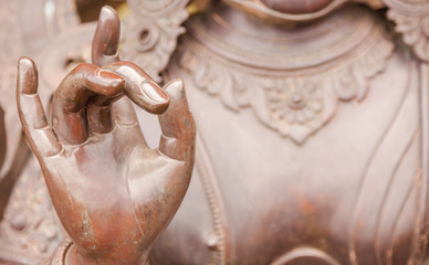 Detail of Buddha statue with Karana mudra hand position - obrazy, fototapety, plakaty
