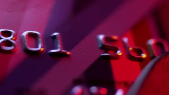 Payment by the credit card. Сredit card in the payment terminal, extreme closeup.
