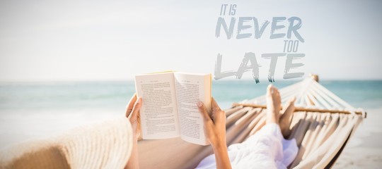 Composite image of woman reading book on hammock at beach