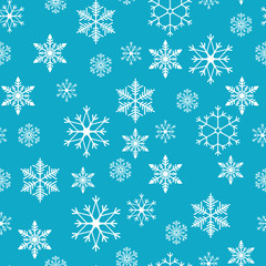 Snowflakes seamless pattern. Snow falls background. Vector illustration. Seamless pattern on a blue background
