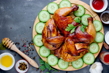 Chicken tabaka served on a wooden plate