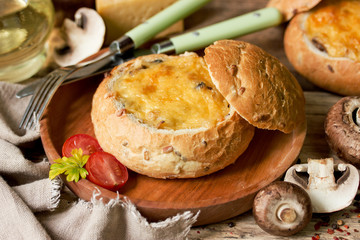 Mushroom julienne with cheese baked in bread bowl