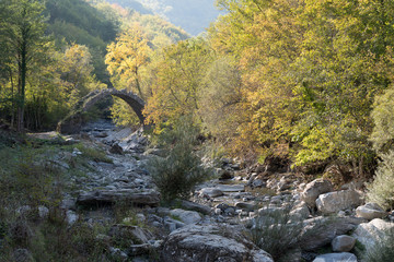 The arch bridge in mountains, Alps, Italy