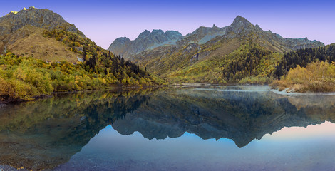 Autumn Lake Kardyvach is a mirror image of the Caucasian Biosphere Reserve. Near Sochi, Russia