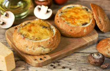 Mushroom julienne with cheese and bechamel baked in bread bowl