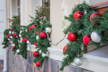 Closeup shoot of christmas decoration balls on facade of a restaurant