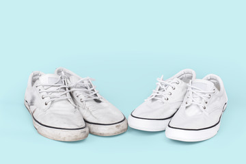 Pair of clean and dirty sneakers on turquoise background