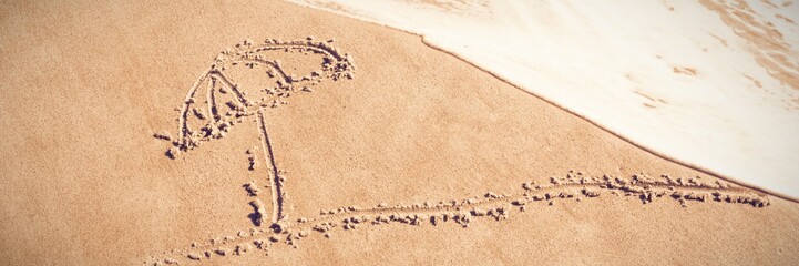 Umbrella and sun drawn on sand