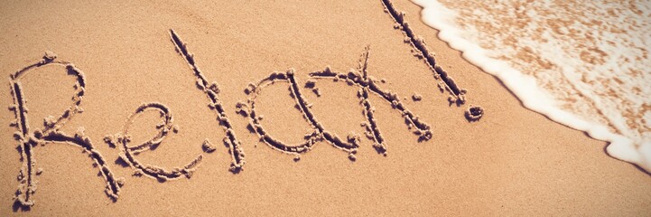 Relax written on sand