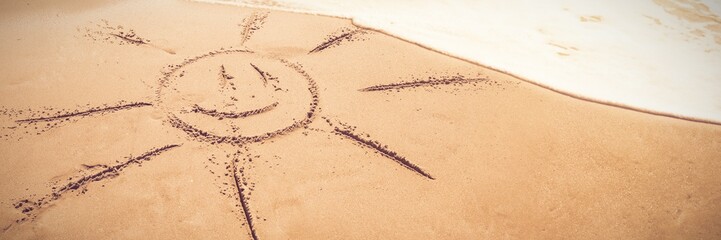 drawing of a sun in the sand