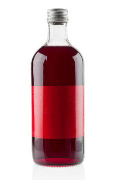 Bottle with cranberry syrup on white background