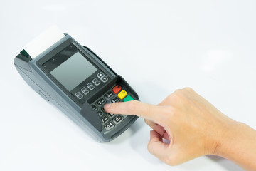 Hand paying for shopping online by secret code by credit card machine