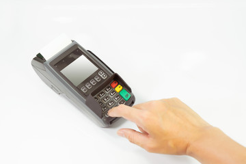 Hand push “Enter” for pay shopping online into a Credit card machine