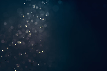 Obraz na płótnie Canvas Glitter lights defocused background. Bokeh dark illustration