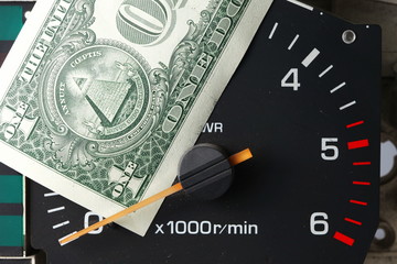Banknote put tachometer gauge scene.