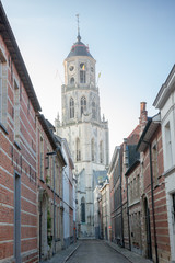 Fototapeta premium Cozy street driving to Saint Gummarus Church on morning, Lier, Belgium