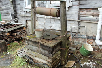 Old abandoned well with a bucket. Russia, 2017