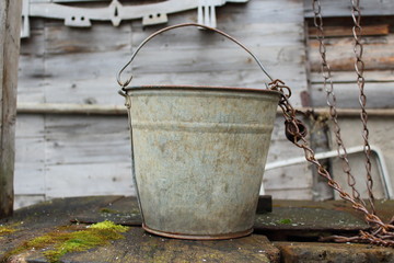 Old abandoned well with a bucket. Russia, 2017
