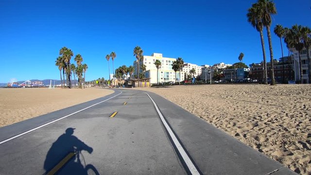 Following shadow on the Santa Monica beach bike path in Southern California.