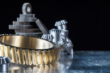 Steel gear and reducer, engineering details. Metal cogwheels. Industry Concept.