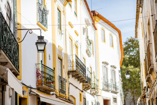 Street view with beautiful old residential buildings in Evora city in Portugal