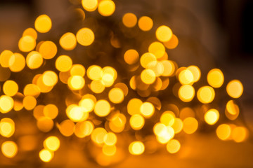 Christmas lights abstract with shiny yellow bokeh effect
