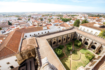 Fototapeta na wymiar Top cityscape view on the old town with courtyard of the main cathedral in Evora town in Portugal