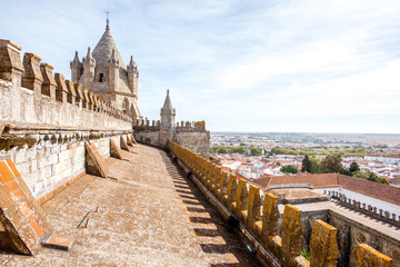 View on the terrace of the main cathedral with beautiful tower in Evora city in Portugal