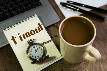 Coffee break! Home office interior in loft space. Workplace with wooden table, office supplies, documents, organizer and laptop. Modern office workplace. 