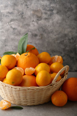 Basket with ripe citrus fruits