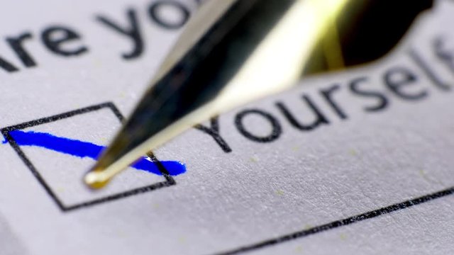 Fill in a form questionnaire. Fountain pen. Extreme close up.
