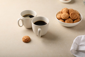 Two cups of espresso and cookies