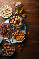 Mixed nuts on wood background