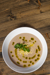 mushroom cream soup on wooden on a wooden background. with copy space. top view