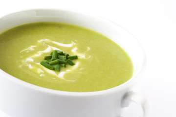 Close up zucchini soup in bowl isolated on white background