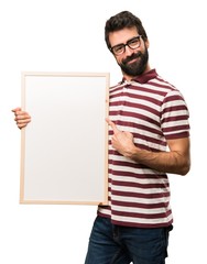 Happy Man with glasses holding an empty placard