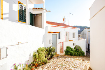Typical village with white houses during the sunrise on the south of Portugal