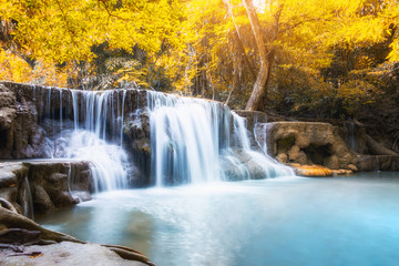 Fototapeta na wymiar Scenic waterfall in rainforest on autumn season at Huai Mae Khamin national park