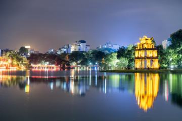 Fototapeta na wymiar Gold Turtle tower with The Huc red bridge in Hoan Kiem lake at night