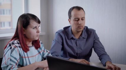 Married couple is meeting financial adviser in the office.