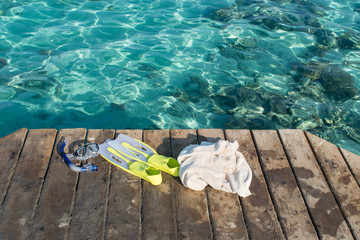 Snorkeling gear and a towel at seaside of Breakers sea walk, Somabay, Hurghada, Egypt.