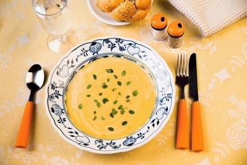 Dense mixed vegetable soup in yellow and orange.