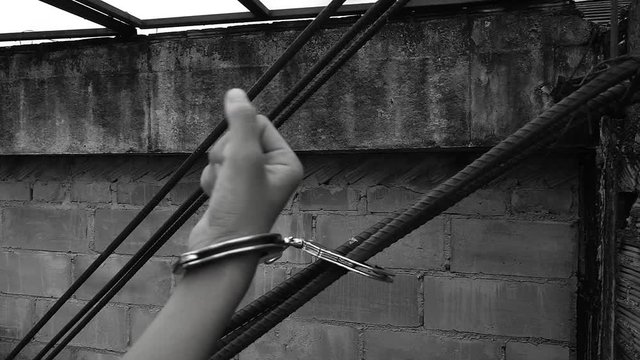 Human trafficking. ,Stop abusing violence.,The boy tied with a rope.