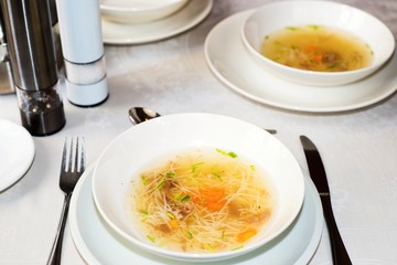 Beef broth in two plates.