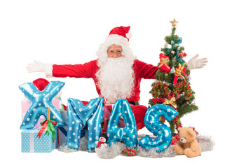 Santa claus with christmas and happy new year concept sitting among giftes, presents, dolls, christmas tree and xmas balloon, isolated on white background with clipping path