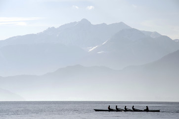 Rowers on row boat, Annecy lake, france
