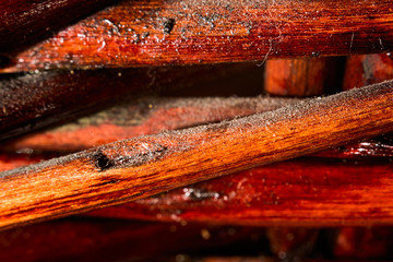 Varnished wooden surface in dust macro