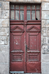Fototapeta na wymiar Old vintage shabby red door