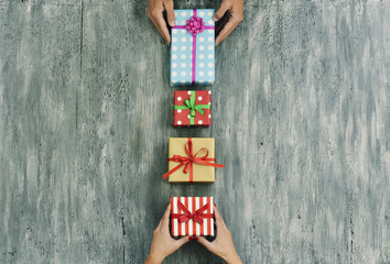 woman and man exchanging gifts