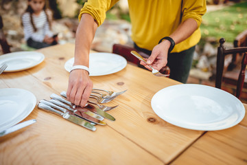 Fototapeta na wymiar Close up photo of woman holding cutlery